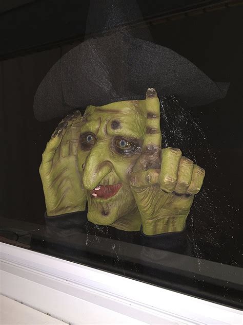 Take your Halloween decorations to the next level with a tapping witch window decoration